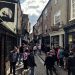 Medieval shopping street full of people