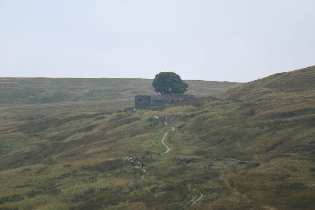 Ruined farmhouse in centre of grey Yorkshire moorlands